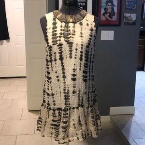 Sleeveless dress with beaded neckline